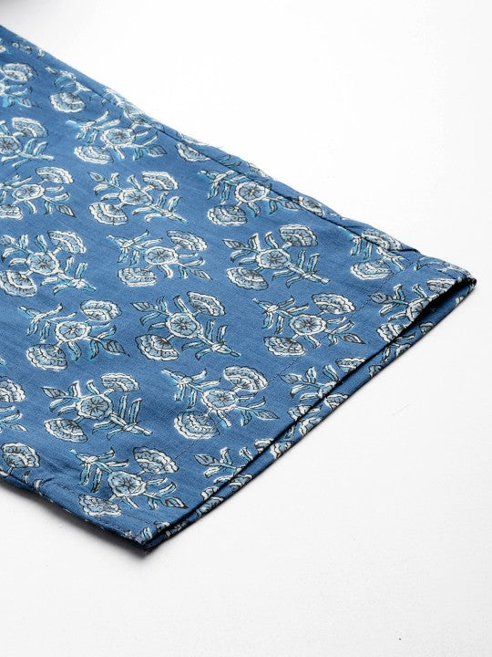Blue fabric with white floral pattern on a white background