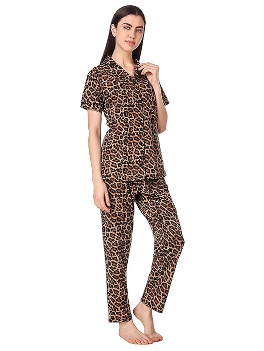 Woman wearing leopard print pajama set on a white background