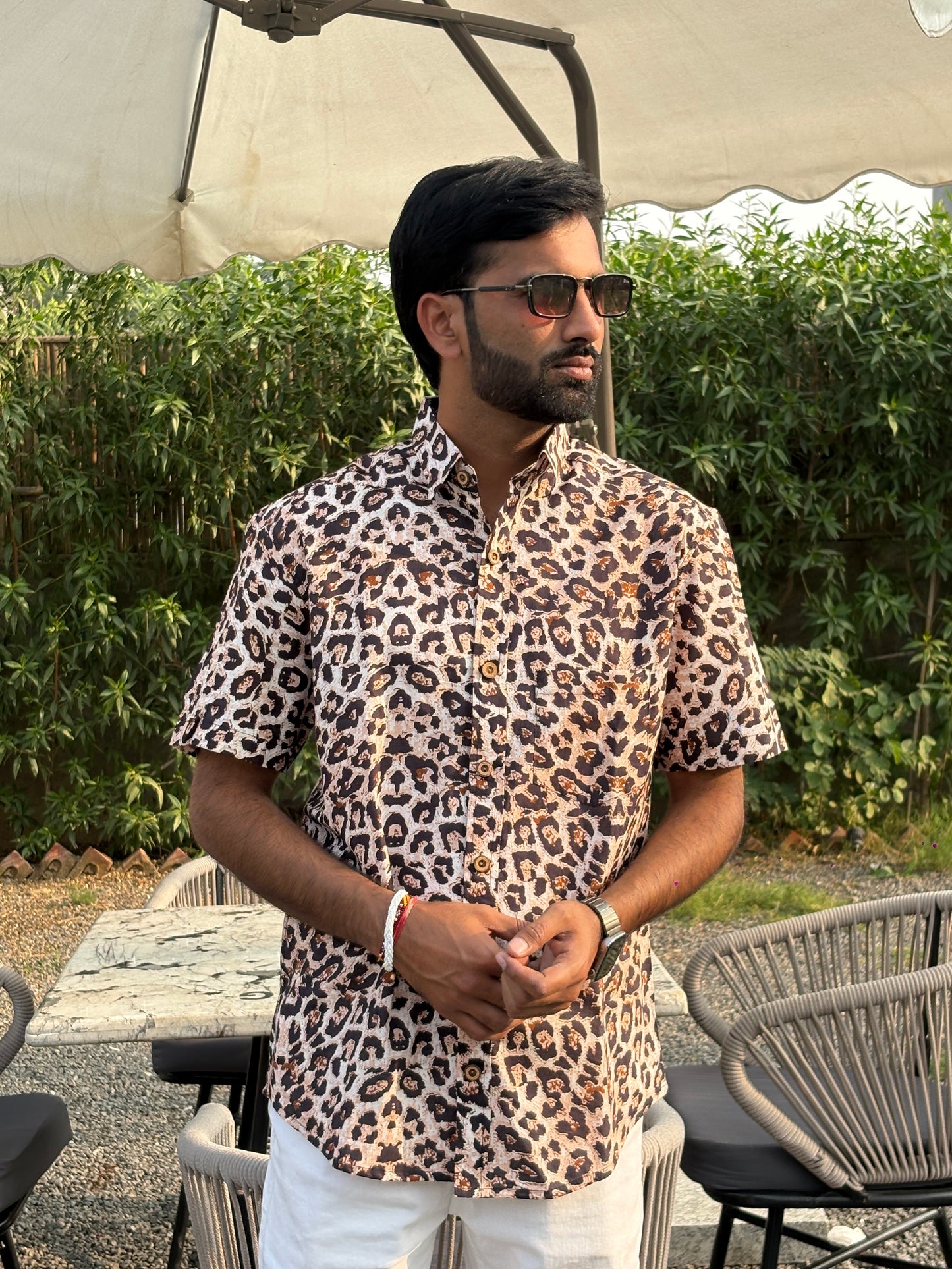 Back close-up highlighting animal print shirt texture