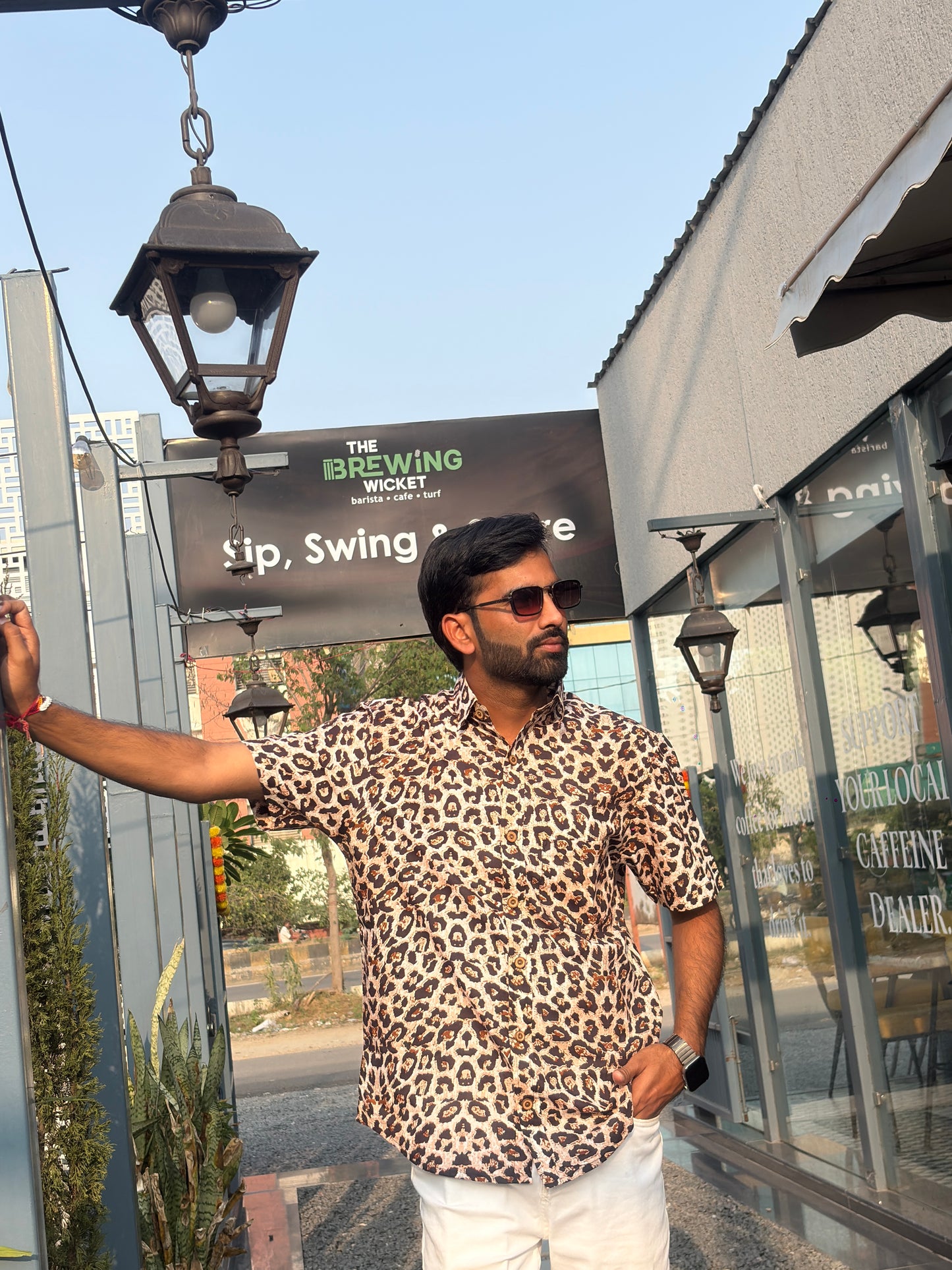 Men wearing beige animal print shirt