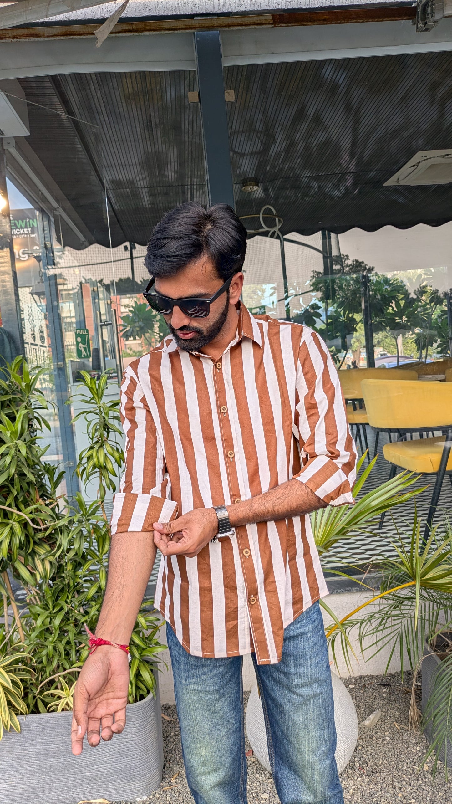 Men wearing brown and white striped shirt