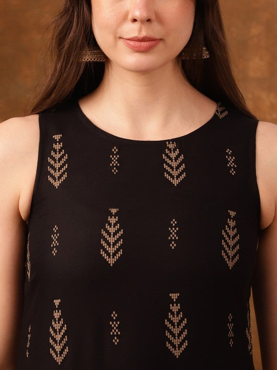 Woman wearing black sleeveless top with gold patterns