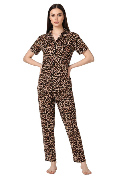 Woman wearing leopard print pajama set on a white background